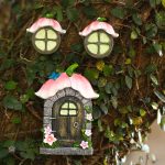 Gnome de jardin avec une maison colorée